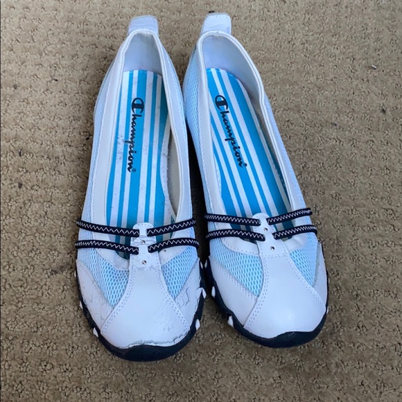 white and blue champion shoes